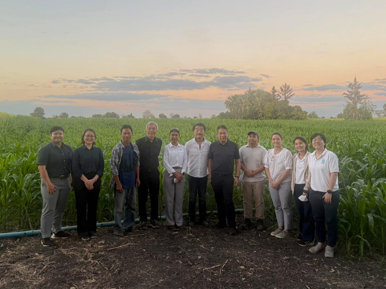 Group standing in front of a field